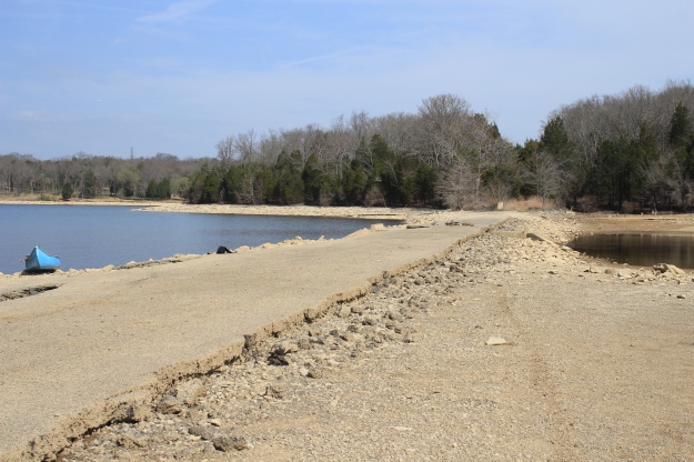 Looking north of an exposed section of Old Hickory Blvd with the Big Blue Beast beached on the shoreline.